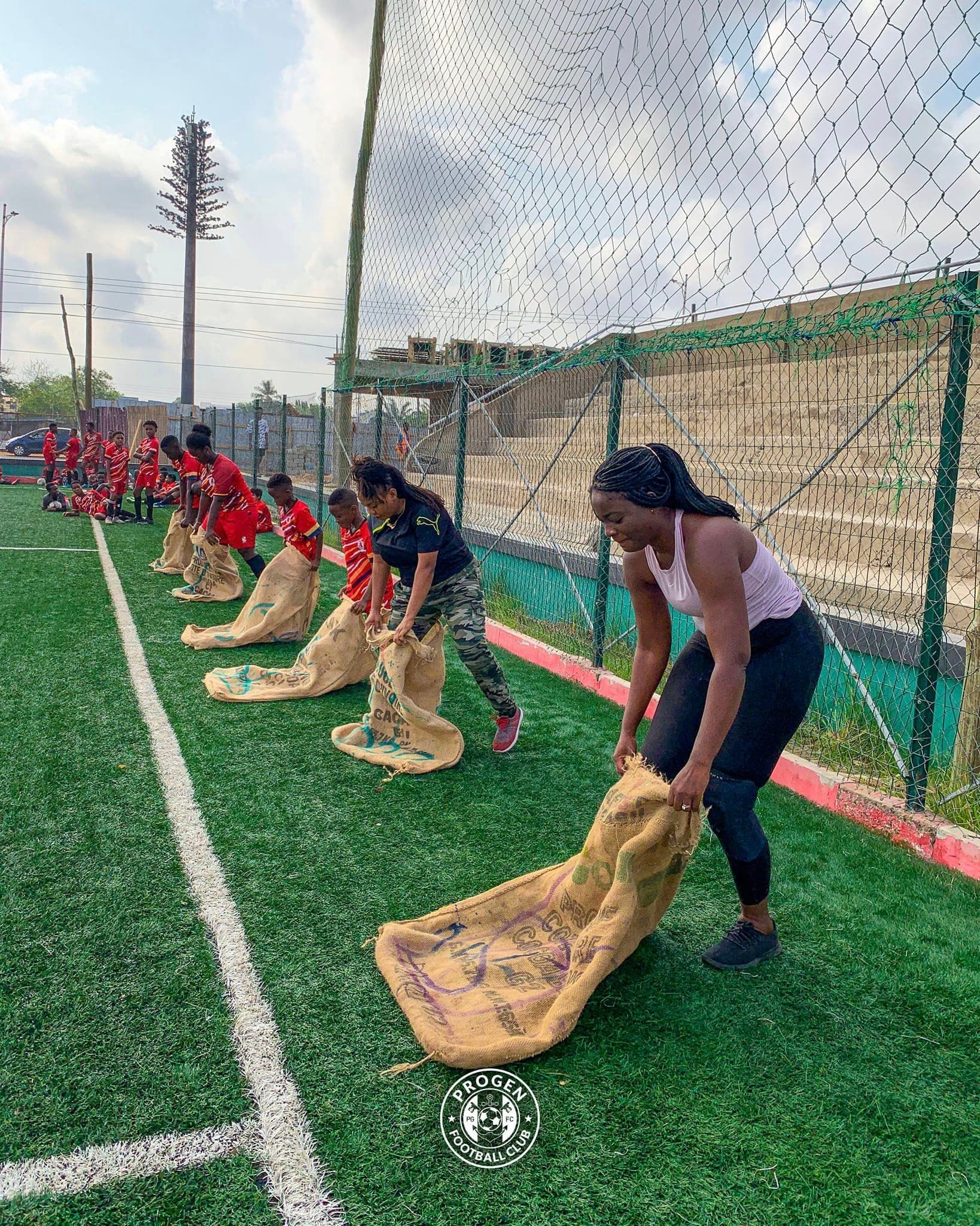 ProGen FC Ladies players lined up for a sack race on the pitch